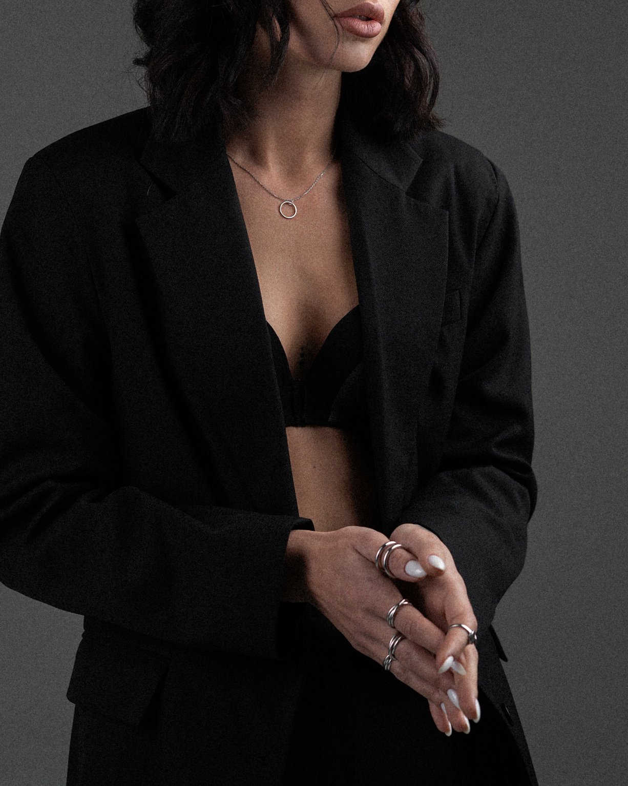 Stylish woman wearing elegant jacket and bra